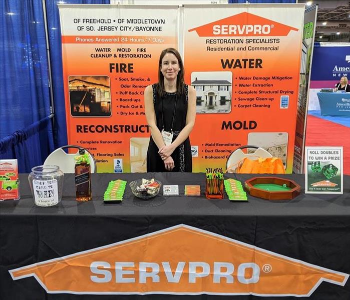 Trade show display and employee. 