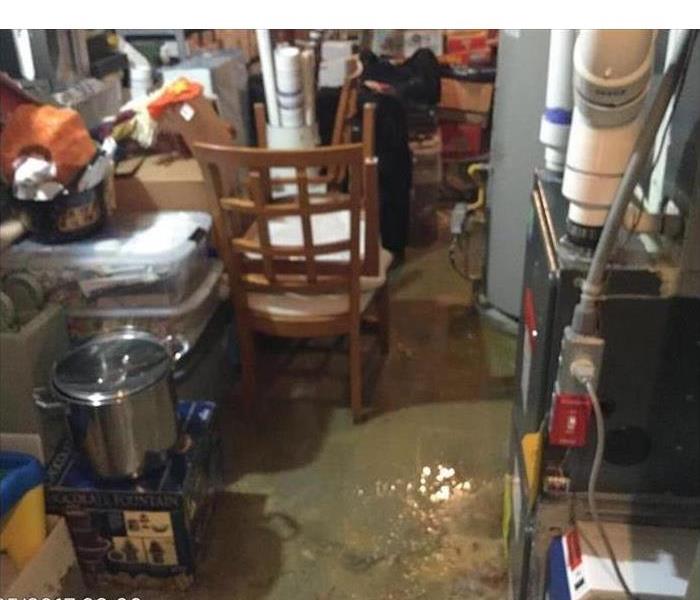 standing water surrounding contents in a basement 