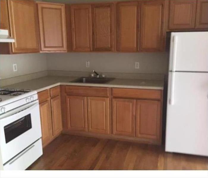 section of clean and new cabinets and counters in a kitchen